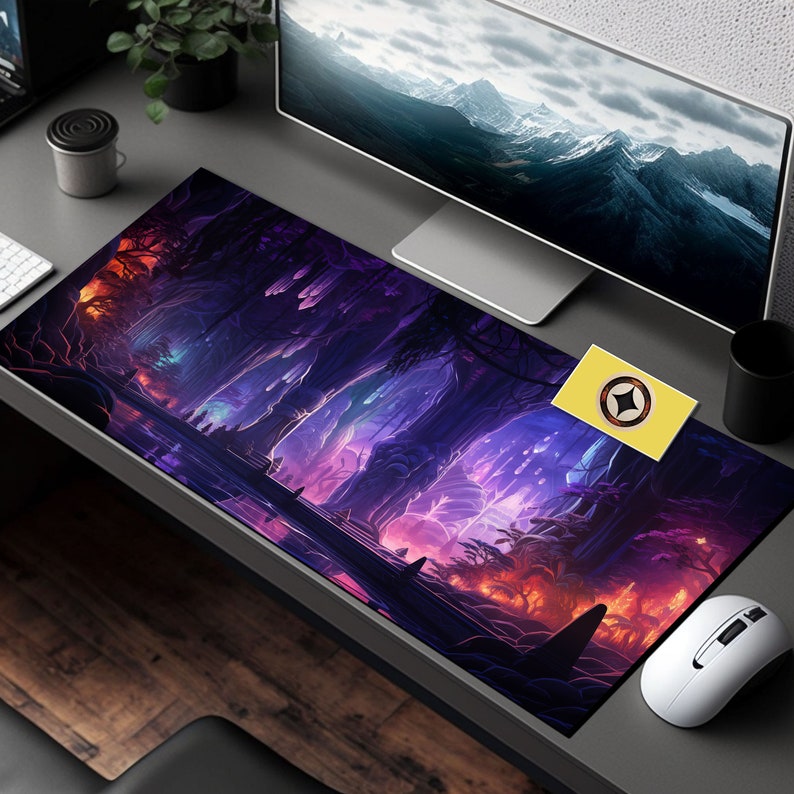 May include: A large, colorful gaming mouse pad with a fantasy forest scene. The pad features a purple, blue, and pink color scheme with glowing trees and a river. The mouse pad is designed for use with a computer mouse.