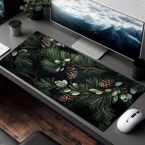 May include: A dark green and black mousepad with a pine branch design featuring gold pine cones. The design is detailed and realistic.