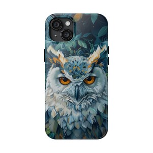 May include: A phone case with a blue and white owl illustration. The owl has yellow eyes and a detailed design. The background is a dark blue with green leaves.