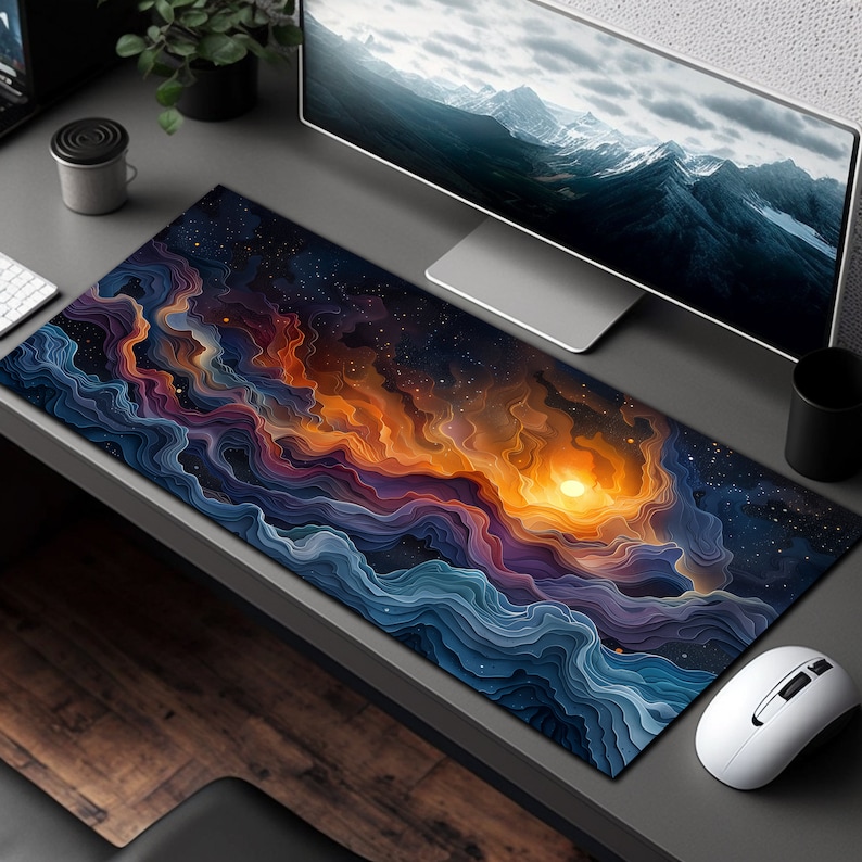 May include: A large, colorful mousepad with a design of swirling, abstract clouds in shades of blue, purple, orange, and yellow. The design resembles a galaxy or nebula with a bright, glowing sun in the center.