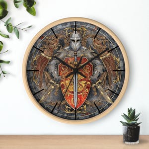 May include: A round wall clock with a wood frame features a knight in armor holding a sword and shield. The knight is surrounded by ornate details and a red, gold, and black color scheme.