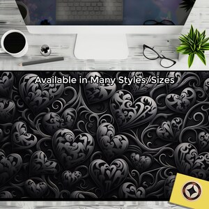 May include: Black and white mouse mat with a repeating pattern of ornate hearts and swirls. The text "Available in Many Styles/Sizes" is at the top of the mouse mat.