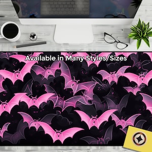 May include: Pink bat silhouettes on a black background. The bats are arranged in a repeating pattern. The text "Available in Many Styles/Sizes" is at the top of the image.