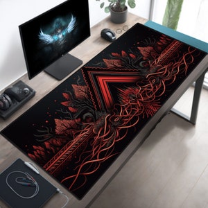 May include: A black and red gaming mouse pad with a geometric design featuring a red triangle and intricate red lines on a black background.