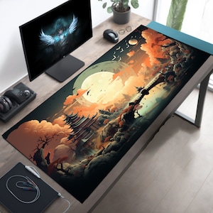 May include: A black and white mousepad with a colorful illustration of a Japanese-style temple, a bridge, and a large moon in a cloudy sky. The illustration is set against a dark background with hints of orange and yellow.