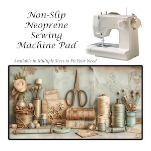 May include: A white sewing machine sits above a non-slip neoprene sewing machine pad. The pad features a vintage-style design with spools of thread, scissors, and a rose. Text on the pad reads "Non-Slip Neoprene Sewing Machine Pad" and "Available in Multiple Sizes to Fit Your Need."