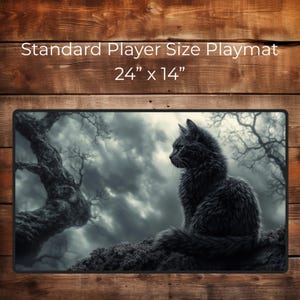 May include: A black cat sits on a rock in a dark, moody forest setting. The cat is looking to the right, with a cloudy sky in the background. The image is for a 24" x 14" playmat.