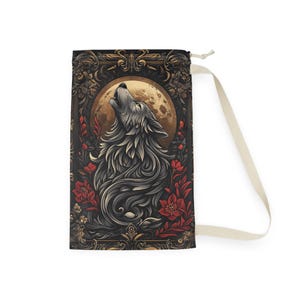 May include: A drawstring bag with a design of a wolf howling at the moon. The wolf is surrounded by red flowers and a gold ornate frame. The bag is made of a natural fabric.