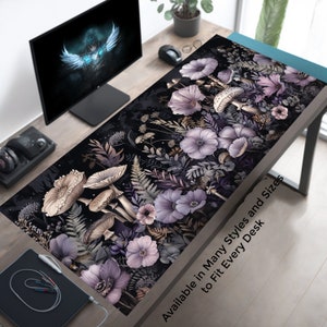 May include: A dark purple and gray floral design with mushrooms and ferns. The design is on a black background and has a white text overlay that says "Available in Many Styles and Sizes to Fit Every Desk".