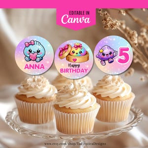 May include: Three circular cupcake toppers with a pastel gradient background and glittery stars. The first shows a blue character with a pink heart and the name ANNA. The second shows a rainbow dumpling in a steamer with HAPPY BIRTHDAY. The third shows a purple character and the number 5.