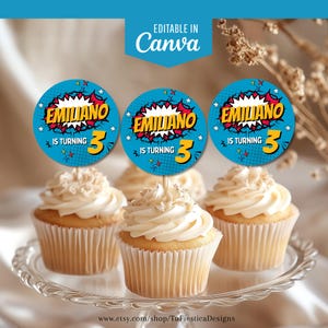 May include: Cupcakes with white frosting and decorative toppers. The toppers are blue circles with the name "EMILIANO" in yellow and red, and the text "IS TURNING 3". The image also includes the text "EDITABLE IN Canva".