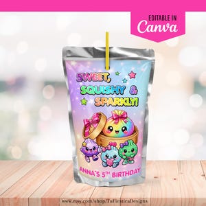 May include: A clear drink pouch with a yellow straw featuring a pastel gradient background, the text "SWEET, SQUISHY & SPARKLY!" and "ANNA'S 5TH BIRTHDAY," and illustrations of colorful, smiling dumpling characters with bows in bamboo steamers.