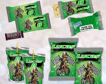 May include: Green and black motocross-themed party favor bags with a checkered flag design and the name "Lucas" and the number "8" printed on them.  The bags are for Rice Krispies Treats, juice boxes, and Hershey's chocolate bars.