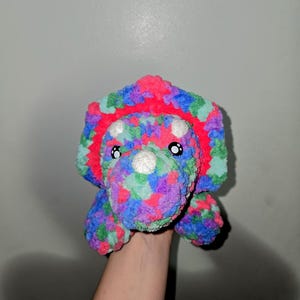 Crochet laying triceratops