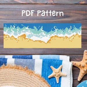 May include: A cross-stitch pattern for a beach scene with blue waves crashing on a sandy shore. The pattern is labeled "PDF Pattern".