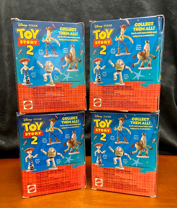 Unopened 1999 Set of Four TOY STORY 2 Die Cast Characters Unopened 1999 Set of Four TOY STORY 2 Die Cast Characters
