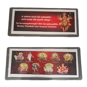 May include: A framed print of nine Hindu goddesses, each depicted with a different animal. The goddesses are surrounded by a red background with a silver border. The print includes the Sanskrit text "Om Sarvamangalamangalye Shive Sarvaathasaadhike Sharanye Triyambake Gauri Naraayani Namostute."