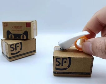 El dispensador de cinta en miniatura real puede funcionar