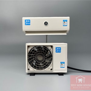 Ventilador de aire acondicionado en miniatura que funciona perfecto para tu casa de muñecas.