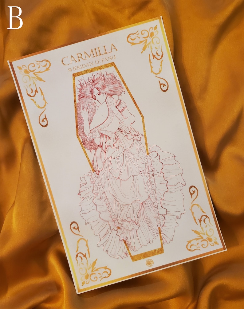 May include: A white print with a gold border featuring a line drawing of a woman in a flowing gown inside a coffin. The text "Carmilla Sheridan Le Fanu" is printed above the image.