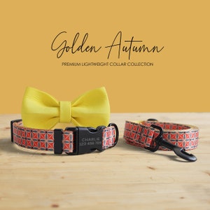 May include: A yellow bow tie and dog collar set with a geometric pattern in red, grey, and white. The collar has a black buckle with the name "Charlie" and a phone number. The text "Golden Autumn" and "Premium Lightweight Collar Collection" are also visible.