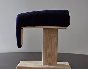 Tailor pressing board for steam ironing of the silhouette of the shoulder.