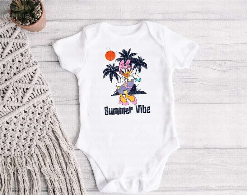 May include: White baby onesie with a cartoon duck wearing sunglasses and a pink bow. The duck is standing in front of palm trees and a setting sun. The text "Summer Vibe" is printed below the duck.