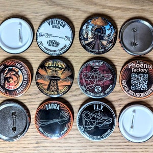 May include: A collection of ten round, colorful buttons with images of roller coasters and the names of amusement parks. The buttons are all different colors and have different designs. The buttons are all about 2 inches in diameter.