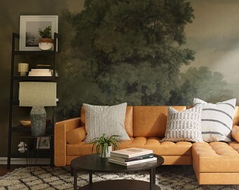 May include: A living room with a brown leather sectional sofa, a black coffee table with two tiers, and a white and gray patterned rug. The wall behind the sofa is decorated with a large painting of a forest scene.