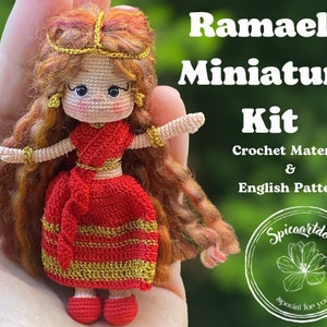 May include: Crochet kit for making a miniature doll with red hair, a red dress with gold trim, and a gold crown. The kit includes crochet material and an English pattern. The kit is labeled "Ramaela Miniature Kit" and "Spicaartdoll special for you".