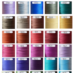 May include: A grid of forty-five spools of embroidery thread in various colors, each labeled with a unique identification number ranging from 1735 to 1851. The threads are arranged in a rectangular layout, showcasing a diverse palette of shades.