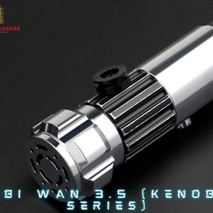 May include: A silver lightsaber with a black grip and a silver emitter. The lightsaber is labelled "Obi Wan 3.5 (Kenobi Series)".