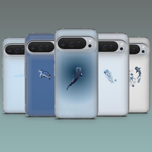May include: A collection of phone cases with ocean-themed designs. Each case features a different aquatic creature, including a whale shark, sea turtle, jellyfish, and dolphins, in shades of blue and white. The cases have a clear, protective design.