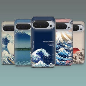 May include: A collection of phone cases featuring Japanese art. The cases display iconic imagery, including "The Great Wave off Kanagawa," Mount Fuji, and a rising sun. The designs incorporate shades of blue, white, and red, with Japanese text.