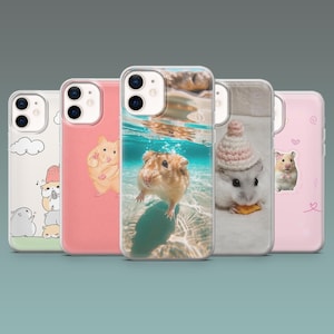May include: Five phone cases with different designs. One case has a hamster swimming underwater, another has a hamster wearing a hat, and others have cartoon hamsters. The cases are in various colors, including pink and white.