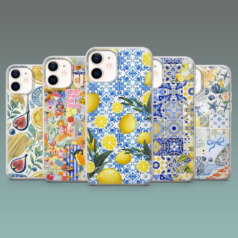 May include: A collection of five phone cases with various designs. The cases feature patterns including lemons, floral arrangements, and blue and white tile motifs. Each case has a clear border and a camera cutout.