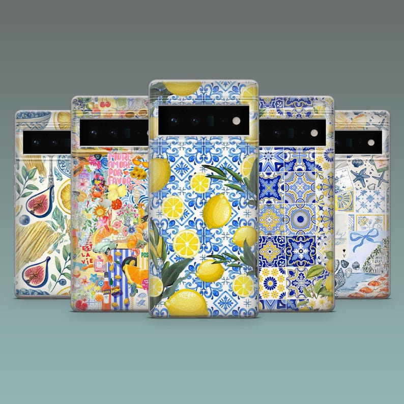 May include: Five phone cases with unique designs. The cases feature various patterns, including lemons, figs, floral arrangements, and blue and white tile motifs. The cases are in a row, showcasing the diverse artistic styles.