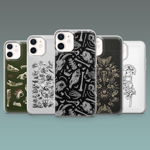 May include: A collection of five phone cases with various designs. The cases feature illustrations of skulls, bones, and insect patterns in black, white, and olive green. The cases are made of a clear, glossy material.