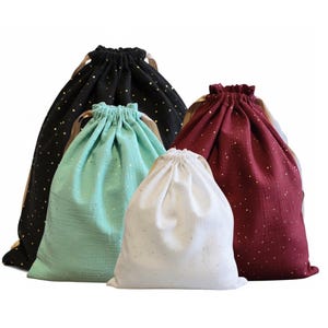 Zero-waste gift wrapping, cotton fabrics and gold ribbons, gold polka dot patterns, reusable drawstring bag, jewelry, storage and travel, Christmas