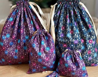 Zero-waste gift wrapping, cotton fabrics and gold ribbons, reusable pouch bags, jewelry, book covers, storage and travel,