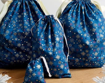 Zero-waste gift wrapping, cotton fabrics and gold ribbons, reusable pouch bags, jewelry, book covers, storage and travel,