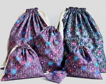 Zero-waste gift wrapping, cotton fabrics and gold ribbons, reusable pouch bags, jewelry, book covers, storage and travel,