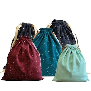 Zero waste gift wrapping, cotton fabrics and gold ribbons, gold polka dot patterns, reusable drawstring bag, jewelry, storage and travel, Christmas