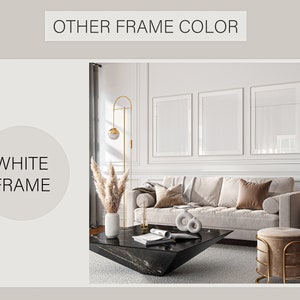 May include: Three white picture frames with white matting are hung on a white wall with white trim. The frames are in a living room setting with a couch, coffee table, and a floor lamp.