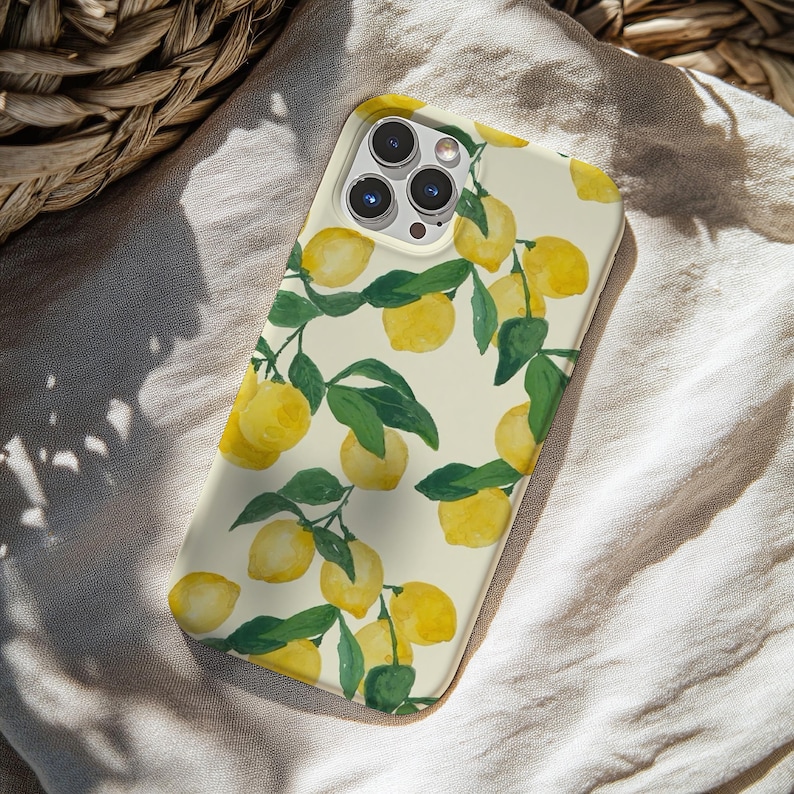 May include: A phone case featuring a watercolor design of lemons and green leaves on a cream background. The case has a glossy finish and is designed to fit a smartphone. The lemon pattern is repeated across the surface.