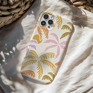 May include: A white phone case featuring a colorful tropical design. The case has a pattern of palm trees in shades of orange, pink, yellow, and green. A yellow sun shape is also included in the design. The phone case is on a white cloth.