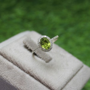925 Sterling Silver Peridot Ring: Oval Gemstone, CZ Diamond