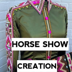May include: A green satin horse show shirt with pink, white and gold embellishments. The shirt has a geometric pattern on the sleeves and collar. The text "HORSE SHOW CREATION" is visible in the image.