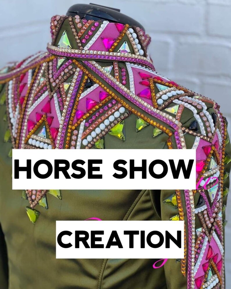 May include: Olive green equestrian show jacket with intricate embellishments. The jacket features pink, white, and iridescent crystal accents, with the text "HORSE SHOW CREATION" in white block letters.