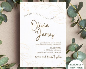 May include: A wedding invitation with a white background and gold leaf accents. The invitation features the names "Olivia + James" in brown script font. The text reads "Nothing fancy just love" and includes the date, time, and location of the wedding. The invitation is decorated with gold leaf accents and a floral design.